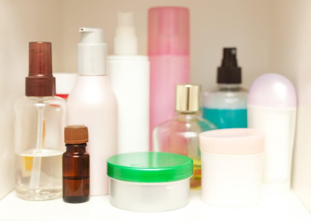 skin care bottles in medicine cabinet