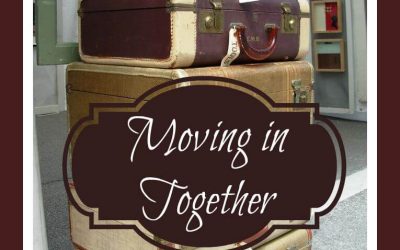 Moving in Together and Staying Stress-Free. There are several vintage suitcases stacked on top of one another.
