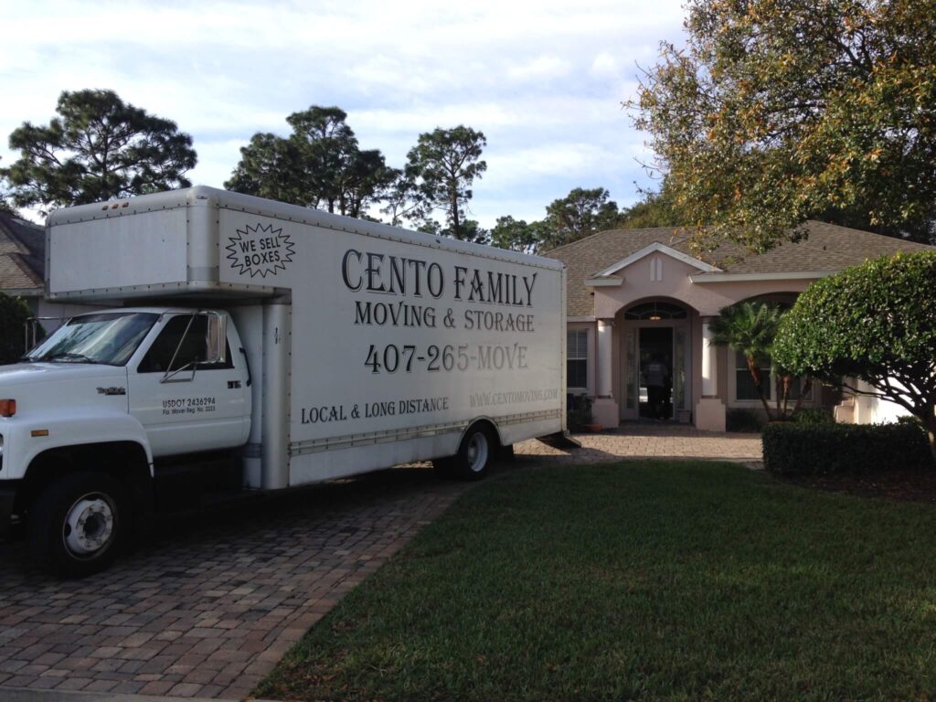 Cento Family Moving and Storage truck backed up to a house