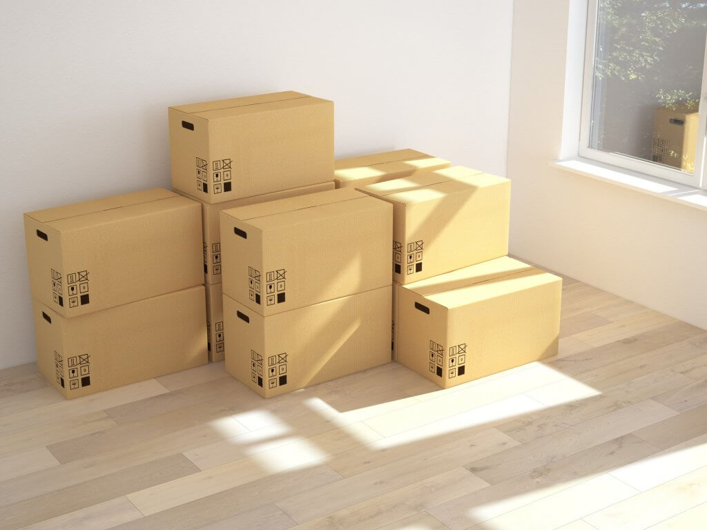 moving boxes stacked in empty room
