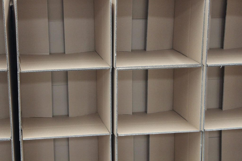 stack of empty cardboard boxes turned on their sides