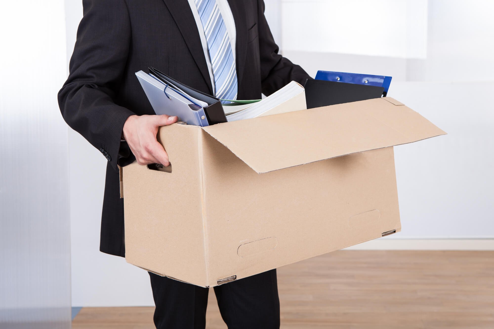 office move checklist - man carrying belongings to next destination