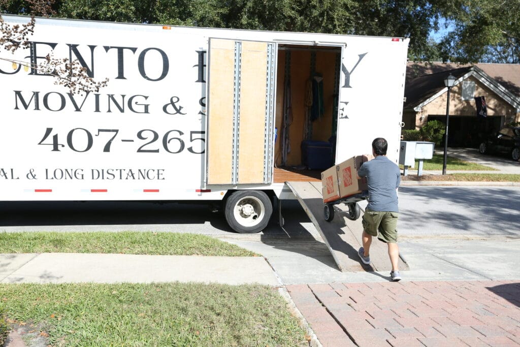 Felipe moving boxes into the moving truck