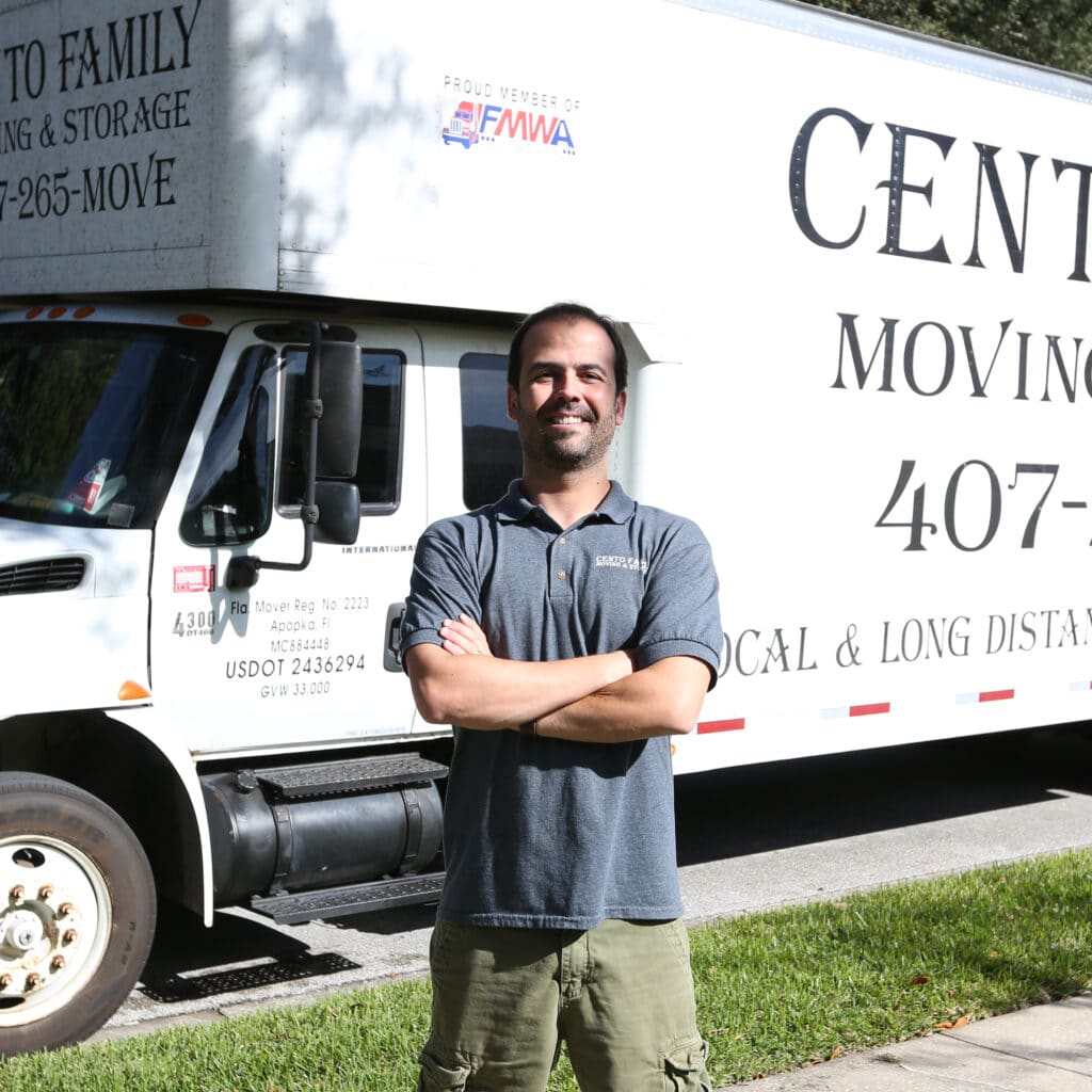 Felipe standing in front of the cento family moving and storage truck