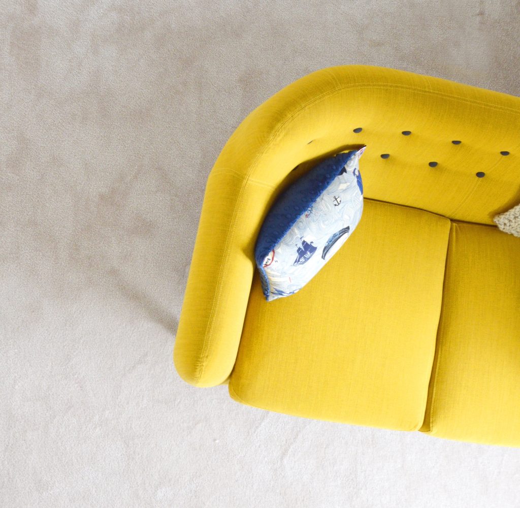Overhead view of yellow couch