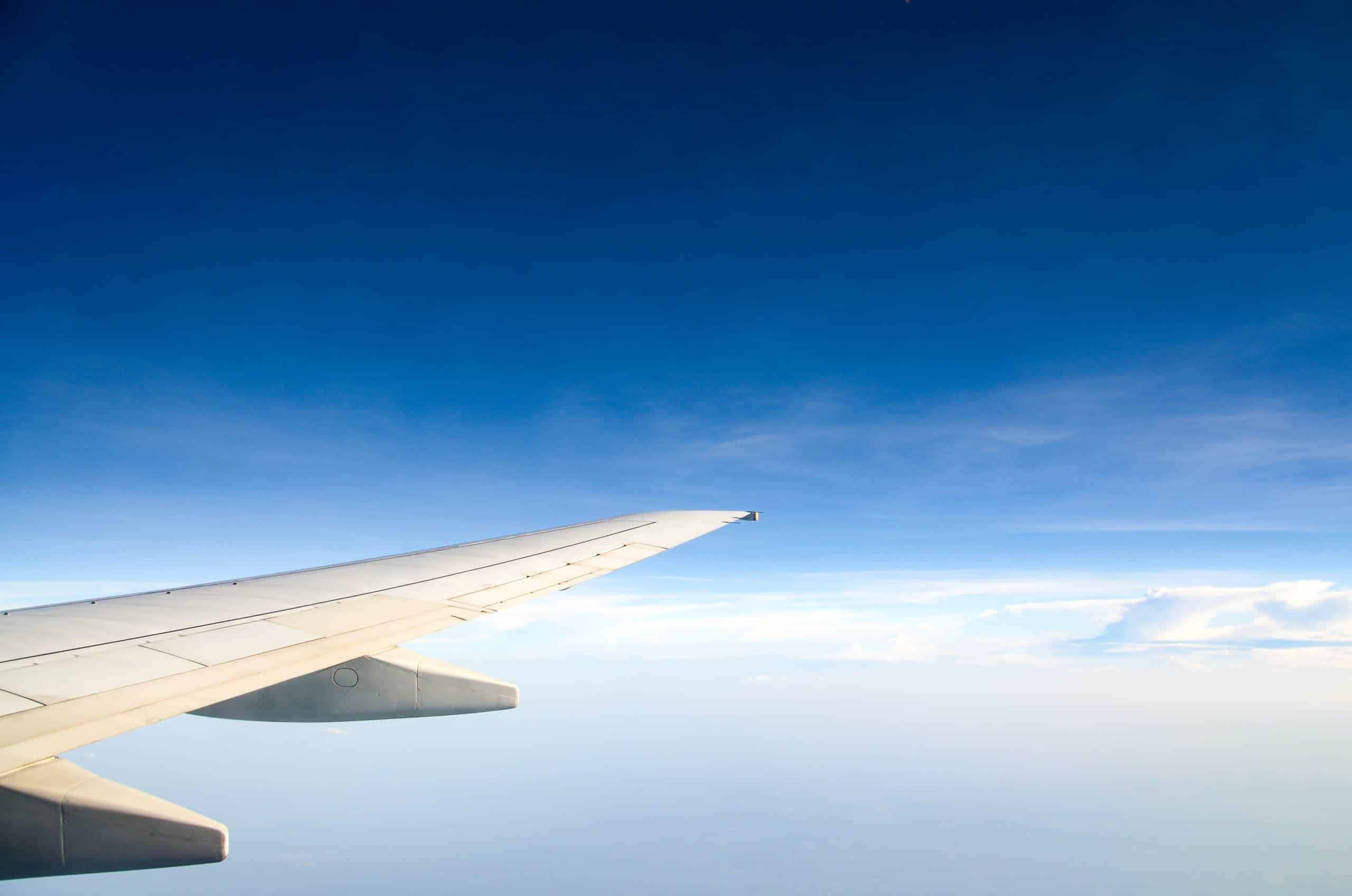 airplane wing viewed from window mid-flight