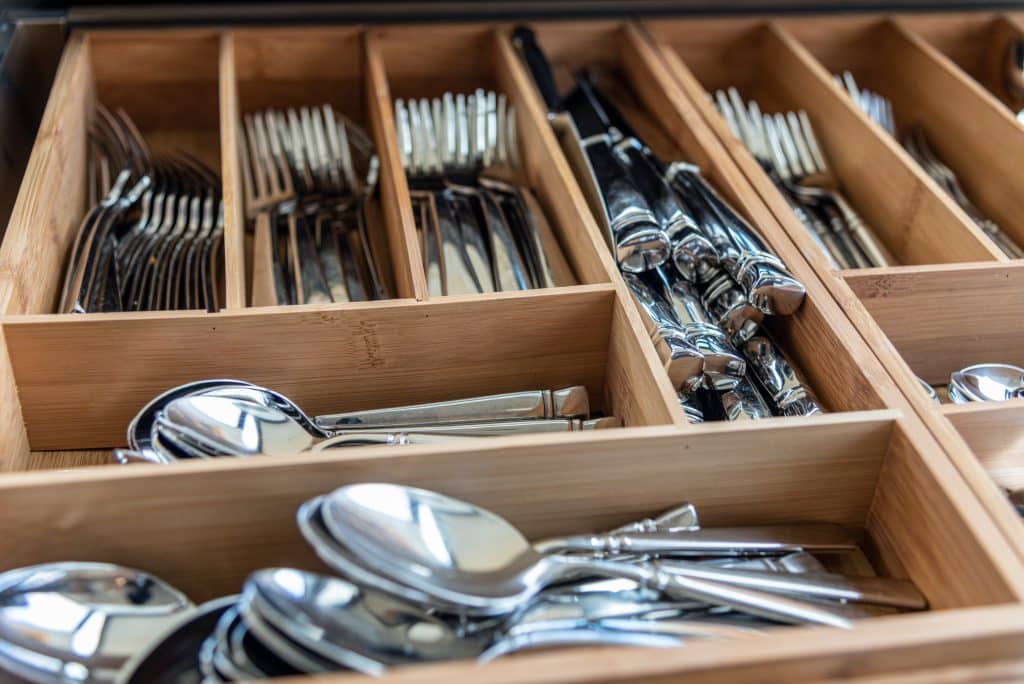 kitchen utensil organizer filled with silverware