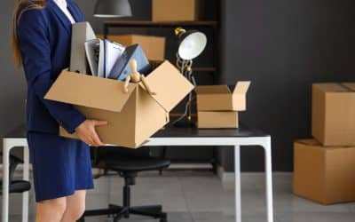 business woman packing her personal belongings in a boxes for a commercial move